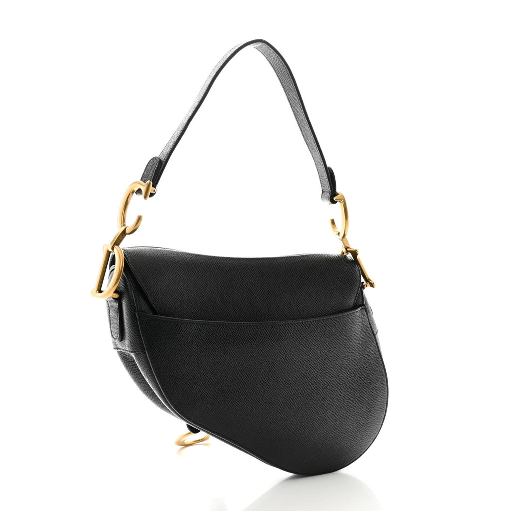 Back view — Dior Saddle Bag Small in black grained calfskin with antique gold-tone D stirrup and adjustable shoulder strap