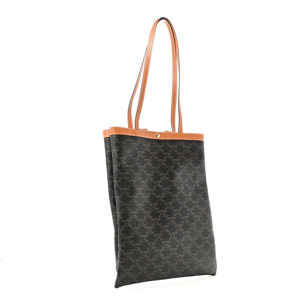 3/4 angle view — Celine Vertical Triomphe Canvas Flat Tote dark canvas tan leather