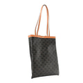 3/4 angle view — Celine Vertical Triomphe Canvas Flat Tote dark canvas tan leather